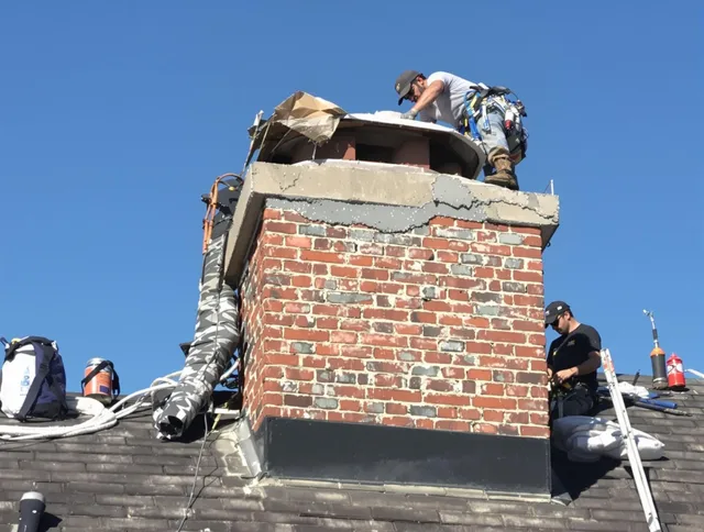 Alafaya Chimney Sweep installing a custom chimney crown in Alafaya, FL